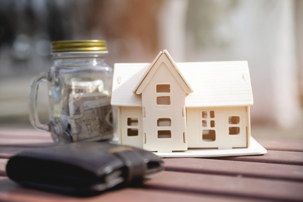 miniature-house-with-savings-jar-wallet